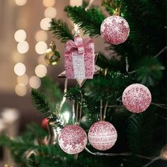 a christmas tree decorated with pink and white ornaments