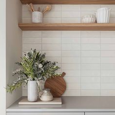 the kitchen counter is clean and ready to be used as a shelf for cooking utensils