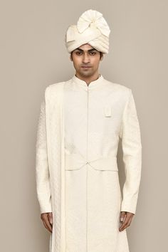 Ivory sherwani with thread, french knots embroidery in diamond pattern. Paired with kurta, churidar, dupatta and belt. Comes with safa, juttis, sevra and tanni. - Aza Fashions Traditional Off White Raw Silk Bandhgala, Traditional Raw Silk Bandhgala In Off White, Ceremonial Cream Bandhgala With Chikankari Embroidery, Cream Bandhgala With Chikankari Embroidery In Raw Silk, Classic Sherwani For Wedding And Festive Occasions, Cream Bandhgala With Chikankari Embroidery For Transitional Season, Designer Off White Wedding Sets, Classic Wedding Sherwani For Festive Occasions, Classic Wedding Sherwani For Festive Season