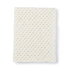 a white knitted dishcloth on a white background