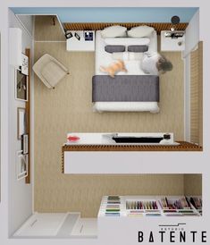 an overhead view of a bed and desk in a small room