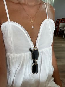 White Mini Dress Chic Summer Maxi Dress For Brunch, Elegant Cotton Sundress For Vacation, Elegant Sundress For Spring Vacation, Summer V-neck Mini Dress For Daytime, Trendy Sundress With Spaghetti Straps For The Beach, Trendy White Maxi Dress For Beach, Flowy Maxi Dress For Daytime Summer, Elegant Cotton Sundress For Summer, V-neck Mini Dress For Summer Daytime