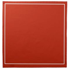 a red place mat with white trim on it and a square shape in the middle