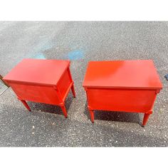 two red end tables sitting next to each other