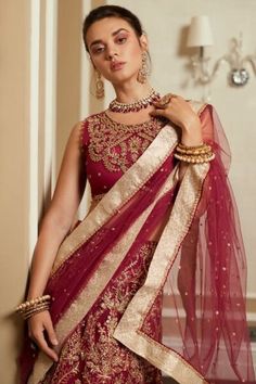 Indian Bridal Red Gold Lehenga Choli comes in a premium texture and is a show-stopper in a premium silk texture. Sparkling embellishments and sequins give a stylish contact to the impeccably sewed Lehenga Dress, exemplifying excellence and beauty.
For more details contact us on our WhatsApp 
+1 (732) 351-5426
Visit our website 
www.nameerabridal.com
#bridaldressonline #bridaloutfit #usabridalgown #usabridaldress #onlinebridaldress #pakistaniwedding   #pakistaniweddingdress #latestbridallehnga #b Choli Dupatta Style, Net Sharara, Silk Sharara, Dupatta Lace, Latest Bridal Lehenga Designs, Gold Lehenga, Dupatta Style, Bridal Lehenga Designs, Raw Silk Fabric