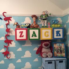 there is a toy shelf on the wall in this child's room with toys