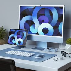 a computer monitor sitting on top of a desk next to a keyboard and mouse in front of a monitor