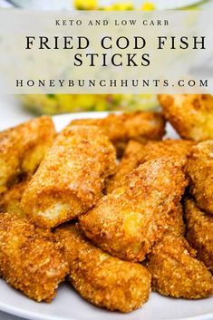 fried fish sticks on a white plate with corn in the background and text overlay