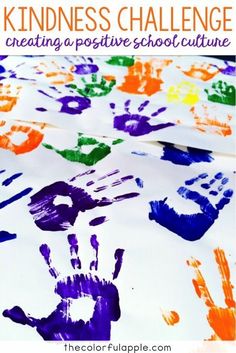 kids's handprints on white paper with the words, kindness challenge creating a positive