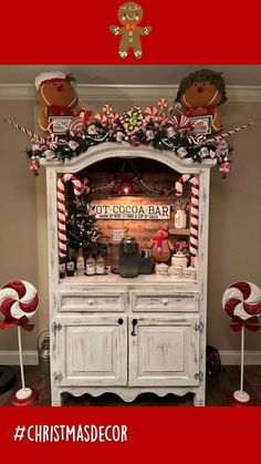 an old hutch decorated for christmas with candy canes and candies on top