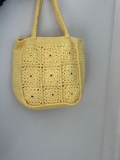 This crochet handmade bag is so cute for spring. It is about 12 inches wide. There is no lining. Durable. So many uses. Cotton thread. Spring Crochet Satchel Bag With Large Capacity, Spring Large Capacity Rectangular Crochet Bag, Spring Crochet Bag With Adjustable Strap, Spring Handheld Crochet Bag With Handles, Casual Crochet Handheld Bag, Casual Square Crochet Bag For Spring, Cute Square Shoulder Bag For Spring, Casual Crochet Handheld Shoulder Bag, Casual Handheld Crochet Shoulder Bag