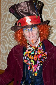 a man with red hair wearing a top hat