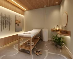 a spa room with a wooden ceiling and large mirror on the wall above it is a white bench that sits in front of a potted plant