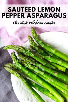 asparagus on a white plate with text overlay that reads sauteed lemon pepper asparagus