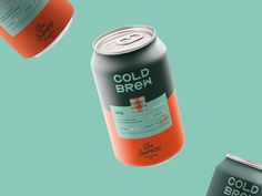 three cans of cold beer on a blue background with the words cold brew printed on them