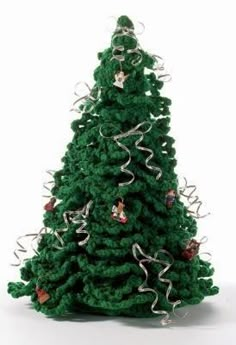 a green christmas tree with white lights on it