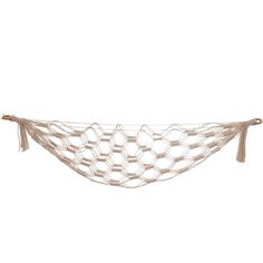 a white string hammock with tassels hanging from the side on a white background