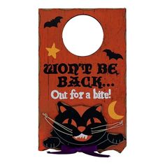 a wooden door hanger with a black cat on it