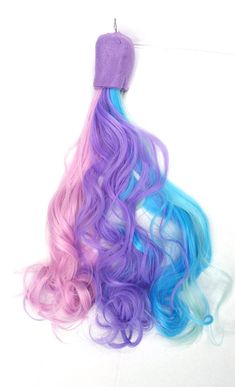 "This tail matches the princess celestia wig in my shop. It is made using purple, lavender, mint green, blue, and pink wavy curled hair. The end has purple felt. This tail is perfect for a unicorn, horse, or pony costume, and it easily attaches to a belt buckle. You can also stick it inside the back of your pants or underneath a belt. It can also be attached by stringing it on a belt as well. It measures about 16\"-21\" COPYRIGHT NOTICE SuperAwwwsome © 2007" My Little Pony Cosplay, Glitter Pills, Unicorn Pony, Chelsea Doll, Pony Horse, Princess Celestia, Mint Blue, Easy Hairstyles For Long Hair, Pink Light