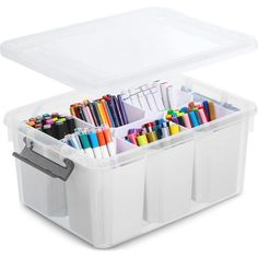 a plastic storage box filled with markers and pencils