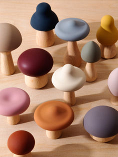 several different colored knobs on top of a wooden surface