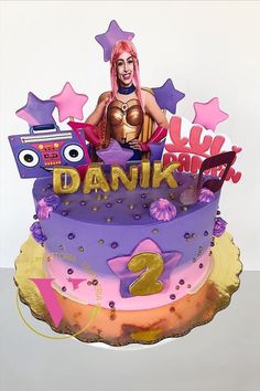 a birthday cake decorated with an image of a woman on top and stars around it