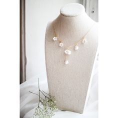 This necklace may be one of my favorite designs I have created yet. The design is incredibly dainty and feminine in nature. Each little white flower is hand-sculpted out of clay and meticulously assembled with gold-filled chain and hardware. The result is a stunning heirloom piece that will become a treasured part of your collection. This necklace measures 15.5in. in length. Delicate Necklace With Flower Charm, Delicate 14k Gold Filled Necklace With Flower Charm, Delicate 14k Gold-filled Necklace With Flower Charm, Delicate Necklace With Flower Charm In 14k Gold Filled, Delicate Flower Necklace For Wedding, Handmade White 14k Gold Filled Necklaces, Handmade White 14k Gold-filled Necklaces, Delicate Wire Wrapped Necklace For Wedding, Delicate Wire Wrapped Necklaces For Weddings