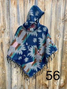 Our hooded big kid ponchos are made of soft acrylic wool-like fabric with colors hand selected from our world travels. XXLarge fits about 8 years up to adult size XS.  Approx up to 5' tall. Thank you very much for supporting our small shop. Bohemian Multicolor Poncho For Outdoor, Multicolor Bohemian Poncho For Outdoor, Multicolor One Size Poncho For Outdoor, Multicolor One-size Poncho For Outdoor, Multicolor Fall Outdoor Poncho, Hooded Winter Poncho One Size, Multicolor Winter Poncho For Outdoor Activities, Cozy Hooded Poncho For Outdoor, Winter Hooded Poncho One Size