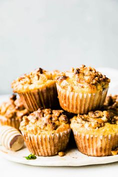 several muffins stacked on top of each other with crumbled toppings