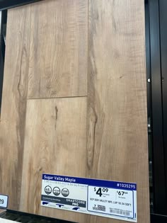 the back side of a wooden wall with price tags on it