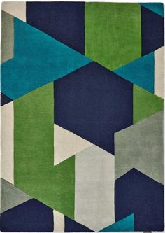 a blue, green and white rug with an abstract design