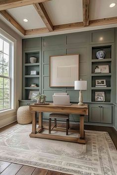 a home office with built in bookcases and a desk