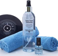 the contents of a personal grooming kit including a bottle of water, towel, and hairdryer