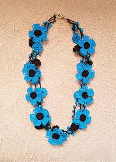 This blue bib necklace is a flower crochet lariat designed for girls and women. It is crocheted with organic cotton thread. This multi strand collar is crocheted with love. It is completely our own design. This beaded lace jewelry is made of cotton thread, beads and crochets. It has 3 strands Handmade Blue Flower Beaded Necklaces, Handmade Blue Flower Beaded Necklace, Blue Crochet Necklace As Gift, Blue Crochet Necklace For Gift, Blue Crochet Necklaces As Gift, Adjustable Blue Crochet Necklaces, Beaded Lace Jewelry, Beaded Crochet Necklace, Autumn Accessories