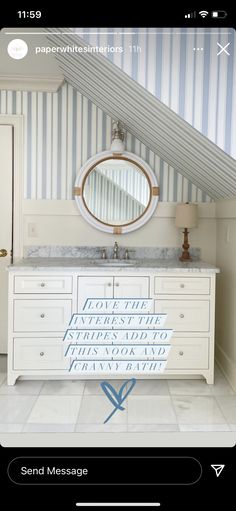 a white bathroom with blue and white striped walls