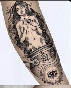 a woman's arm with a tattoo on it and an image of her breast