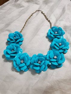 Thermoset Style, Turquoise Blue Flower and Rhinestone Beaded, 22-inch Necklace, Gold Toned Chain, Costume Jewelry, Fashion Accessory This is a great find. Very decorative and collectible. The flowers measure 2 inches in diameter. Please note that this information was found out from research and there is no hallmark on this necklace. Check out our shop for monthly specials. We have a variety of items for every taste. Combine several of our items together to save on shipping. If you have any quest Turquoise Flower Jewelry For Party, Blue Beaded Necklace With Flower Pendant, Blue Flower Pendant Beaded Necklace, Easter Necklace, Large Necklace, Bleu Turquoise, Rhinestone Bead, Blue Flower, Spring Colors