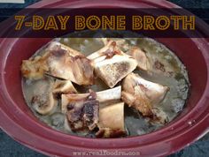 a red bowl filled with meat and broth next to a sign that says 7 - day bone broth