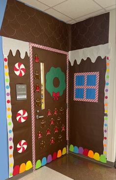 an open door decorated with gingerbreads and candy canes