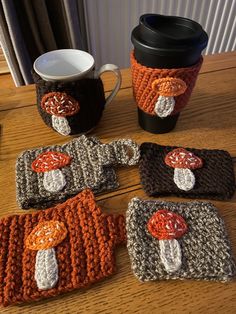 crocheted coffee cups and mug cozyies on a table