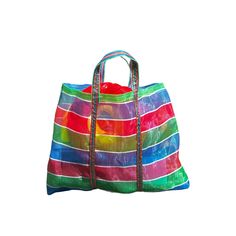 a multicolored bag is shown against a white background, with the handles down