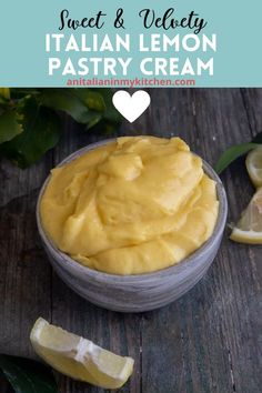 a bowl filled with lemon pastry cream next to sliced lemons