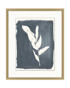 an abstract painting with white flowers in a gold frame on a black and white wall