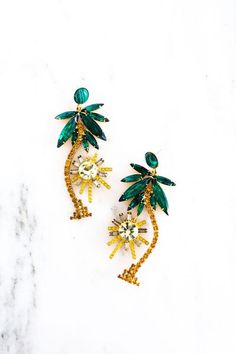 Palm tree earrings with Swarovski crystals and glass stones. Materials: Swarovski crystals glass stones 24ktåÊgold plate Closure:åÊpost closure Availability: ships within 5-7åÊbusiness days Tropical Gifts, Glamorous Jewelry, Elizabeth Cole, Tree Earrings, Tropical Colors, Earring Tree, Czech Crystal, 24kt Gold, Palm Tree