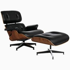 the eames chair and ottoman is shown in black leather