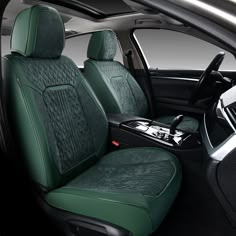 the interior of a car with green seats and steering wheel covers on it's side