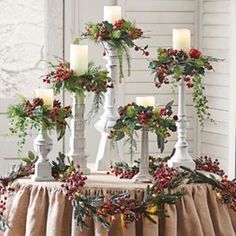 christmas decorations with candles and greenery