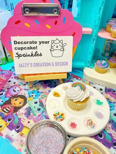 cupcakes and other treats are on display at the store's birthday party