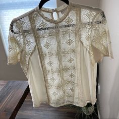 Hinge Cream Embroidered Lace Boho Short Sleeve Blouse Top Small. Gorgeous Top, Never Worn. Loved That It Has A Open Back With Buttons From The Bottom To The Top. I Honor Poshmark's Return Policy. I Do My Best To Clearly Represent My Items. Shop With Confidence! 5 Star Rated Posh Ambassador, Fast Shipping From A Clean Smoke Free Home! I Welcome All Questions And Offers! Happy Shopping! Embroidered Short Sleeve Lace Blouse, Short Sleeve Embroidered Lace Blouse, Embroidered Lace Blouse With Short Sleeves, Feminine Fitted Embroidered Lace Top, White Short Sleeve Tops With Delicate Lace, White Short Sleeve Top With Delicate Lace, Feminine Short Sleeve Tops With Lace Work, Short Sleeve Tops With Lace Work For Spring, Floral Embroidery Lace Top With Short Sleeves