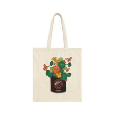 This tote bag featuring Italian coffee "Caffe Vergnano" and bright yellow and orange Nasturtium flowers is bursting with color and would be a fun gift for anyone who loves coffee! This 100% cotton bag comes in one size - 15" x 16"- perfect for everyday wear. The bag features 20" handles (made from the same canvas), making it easy to carry groceries, books, your laptop or any other belongings comfortably. It is made from high-quality and durable canvas material, making it perfect for everyday use Brown Large Capacity Canvas Bag As Gift, Brown Large Capacity Canvas Bag For Gift, Yellow Canvas Bag As Gift, Retro Yellow Bag As Gift, Retro Yellow Bag For Gift, Vintage Rectangular Canvas Bag As Gift, Retro Tote Bag As Gift, Large Capacity Natural Canvas Bag Gift, Eco-friendly Yellow Canvas Bag As A Gift